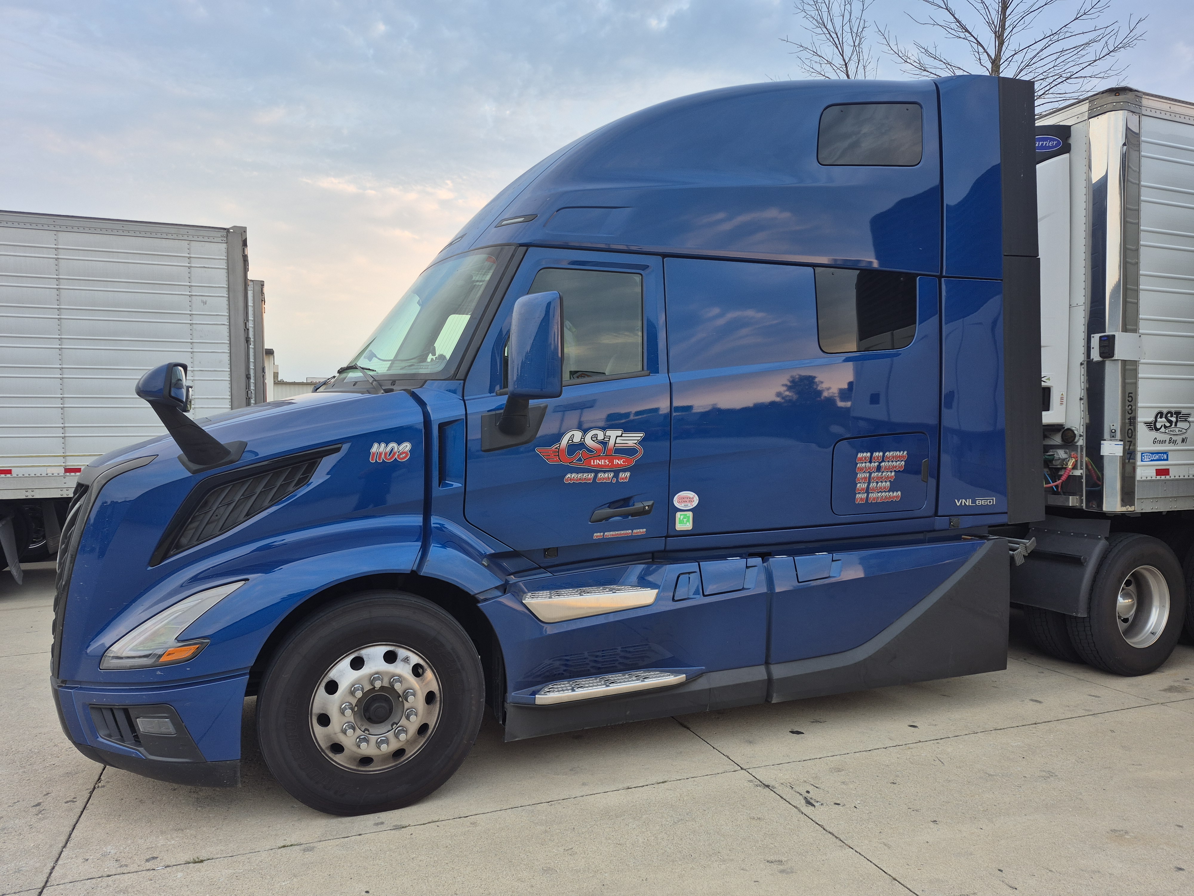Blue Volvo VNL 860 sleeper with CST Lines reefer trailer